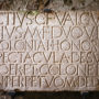 Stone panel in Latin at the ancient Roman city of Pompeii